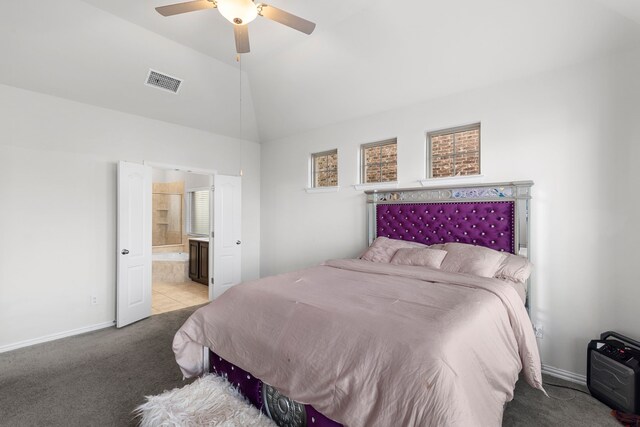 bedroom with light colored carpet, ensuite bath, ceiling fan, and lofted ceiling