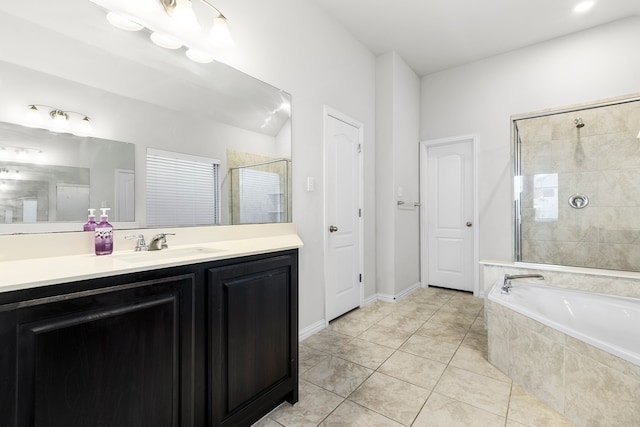 bathroom featuring tile patterned floors, vanity, and shower with separate bathtub