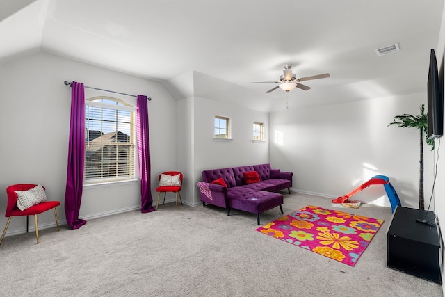 rec room with ceiling fan, light colored carpet, and lofted ceiling