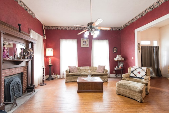 living room with ceiling fan and hardwood / wood-style floors