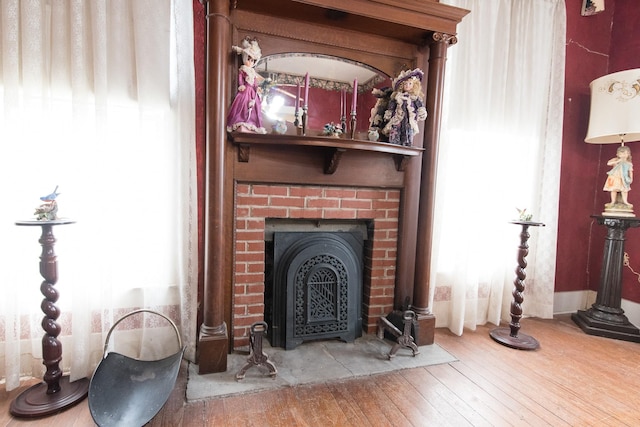 room details with a fireplace and hardwood / wood-style floors