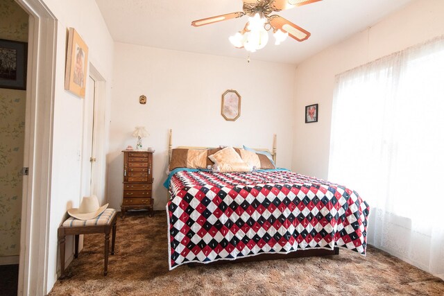 carpeted bedroom featuring ceiling fan