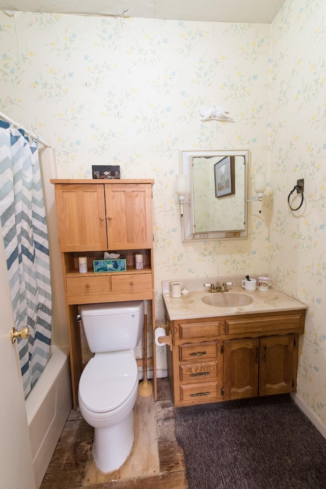 full bathroom featuring hardwood / wood-style flooring, shower / tub combo with curtain, vanity, and toilet