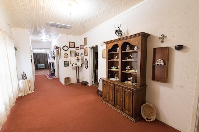 hallway featuring carpet