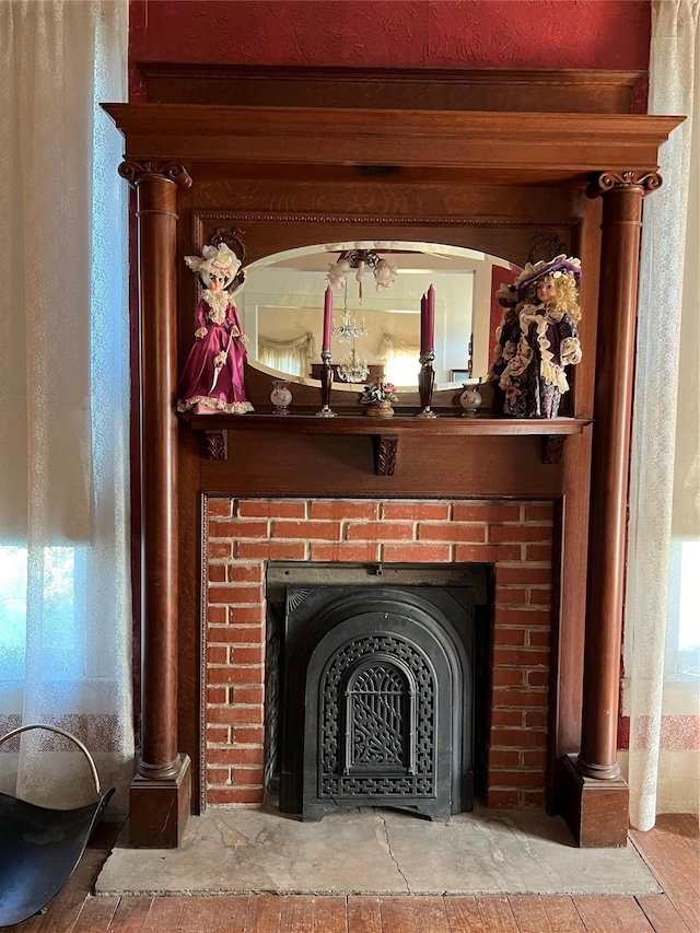 interior details with a brick fireplace