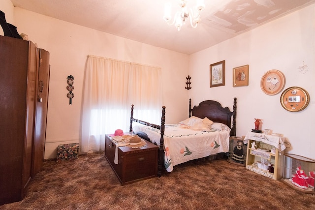 bedroom featuring an inviting chandelier and dark carpet