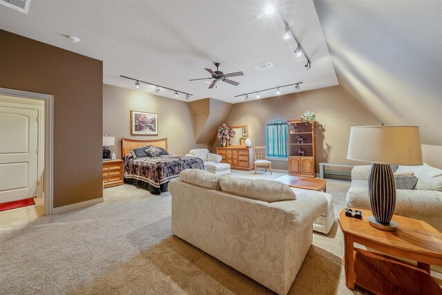 bedroom with vaulted ceiling, light carpet, and ceiling fan