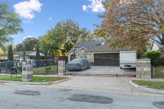 view of gate featuring a garage