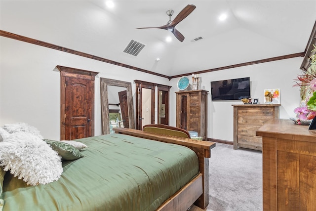 bedroom featuring ceiling fan, light colored carpet, ornamental molding, and vaulted ceiling