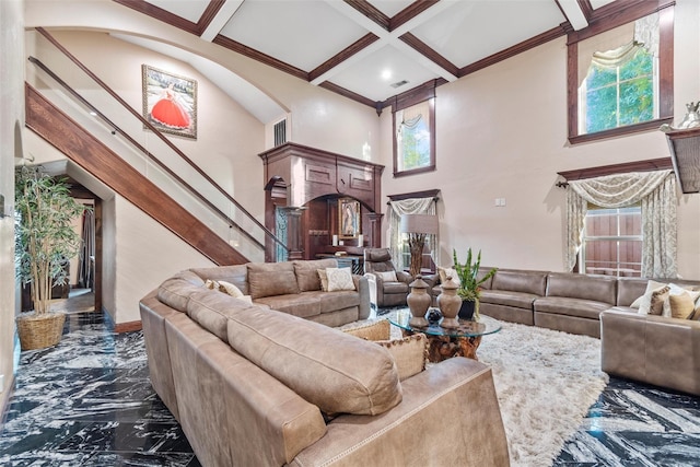 living room with beam ceiling, a towering ceiling, ornamental molding, and coffered ceiling