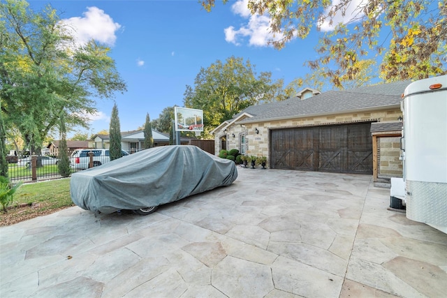 view of patio / terrace with a garage and grilling area