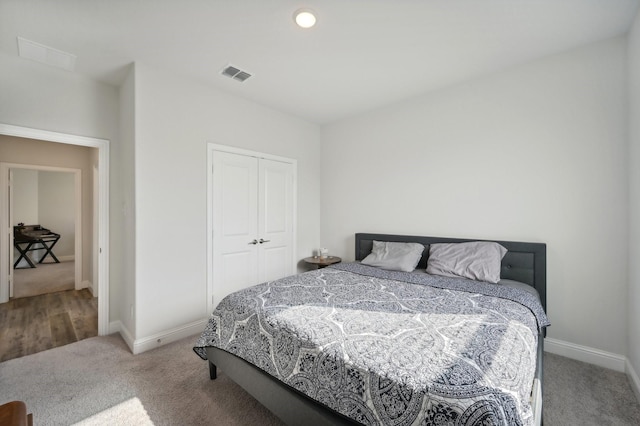 carpeted bedroom featuring a closet