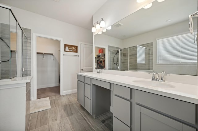 bathroom with vanity and an enclosed shower