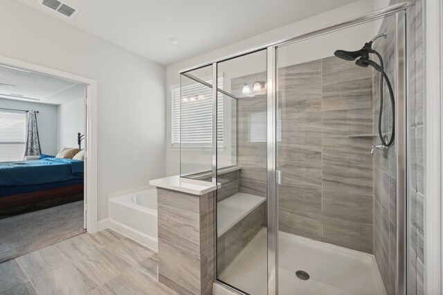 bathroom featuring plus walk in shower