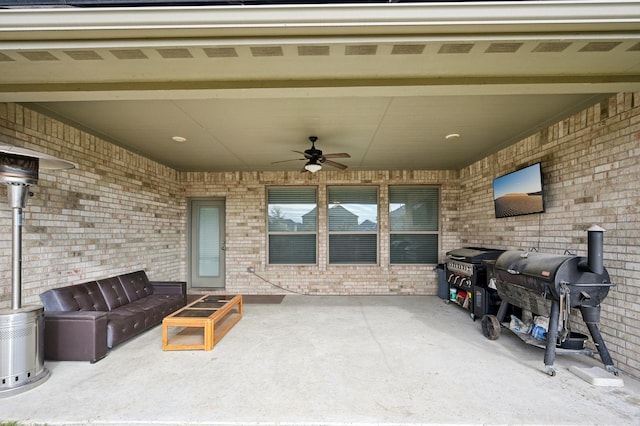 view of patio featuring an outdoor living space, ceiling fan, and grilling area