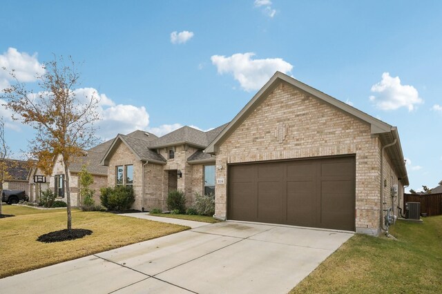 view of front facade with central AC, a front lawn, and a garage