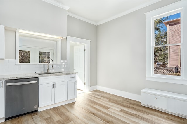 kitchen featuring sink, ornamental molding, light stone countertops, white cabinets, and stainless steel dishwasher