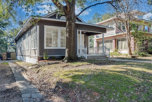 view of front of home featuring a porch and a front yard