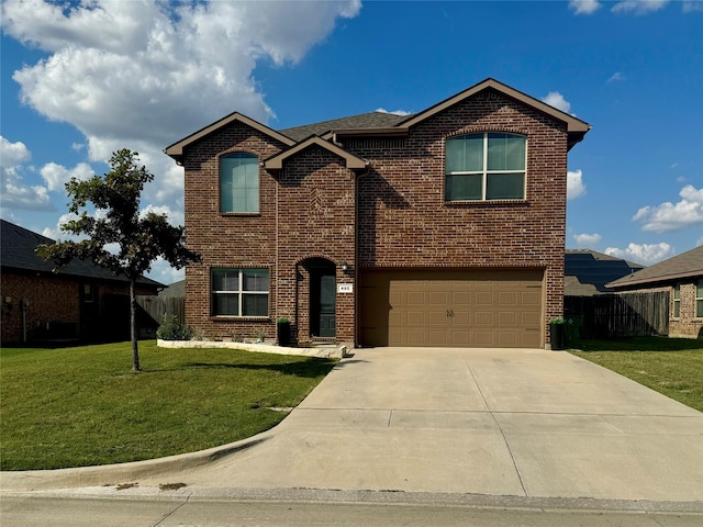 view of property featuring a garage and a front yard