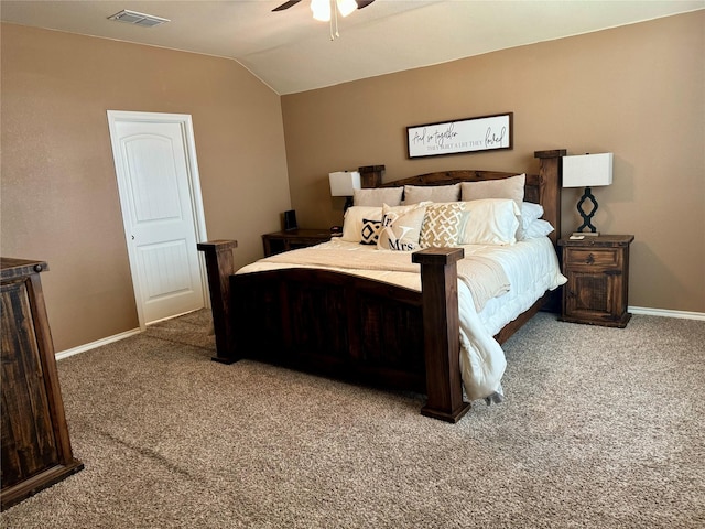 carpeted bedroom with vaulted ceiling and ceiling fan