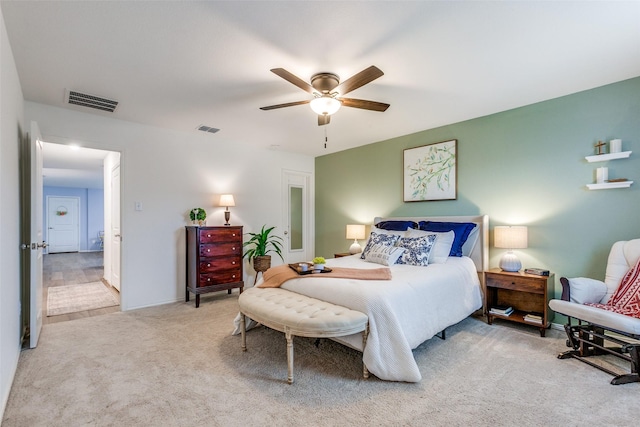 bedroom with light colored carpet and ceiling fan