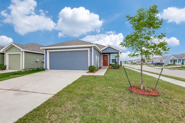 view of front of property with a garage and a front yard