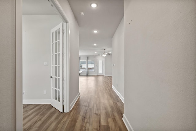 hallway featuring french doors and hardwood / wood-style flooring