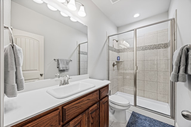 bathroom featuring tile patterned floors, vanity, toilet, and an enclosed shower