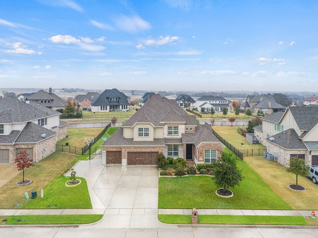 view of front of property featuring a front yard and a garage