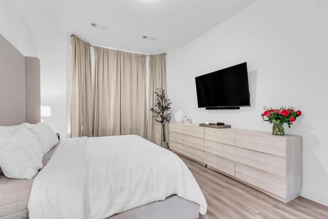 bedroom with wood-type flooring