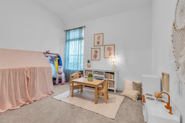 recreation room with carpet and lofted ceiling