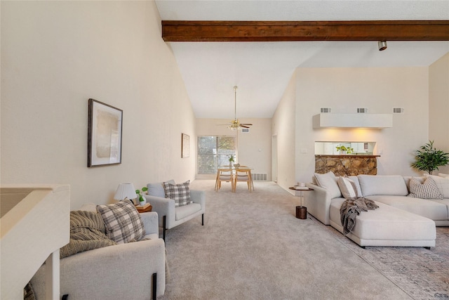 living room featuring high vaulted ceiling, beam ceiling, and light colored carpet