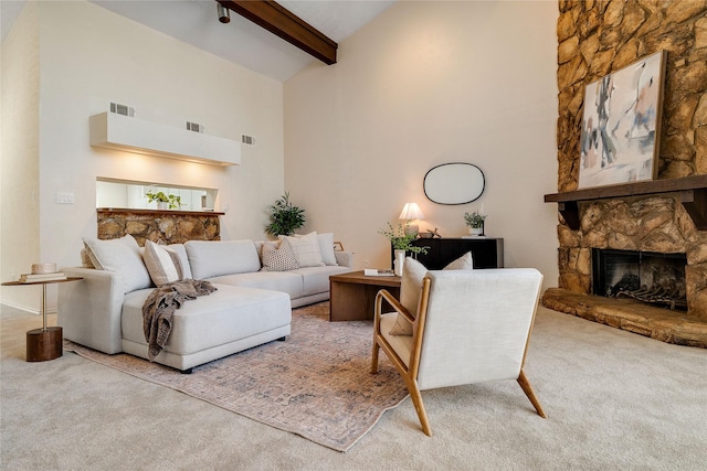 living room featuring carpet, high vaulted ceiling, a fireplace, and beamed ceiling