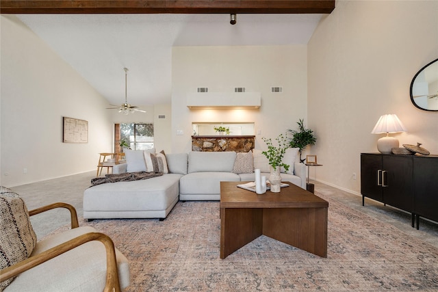 carpeted living room with ceiling fan, beam ceiling, and high vaulted ceiling