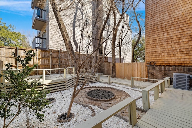 view of patio featuring a wooden deck and central AC unit