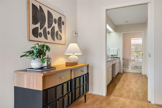 hall with light wood-type flooring