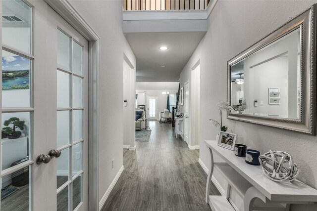 entrance foyer featuring a healthy amount of sunlight and dark hardwood / wood-style floors