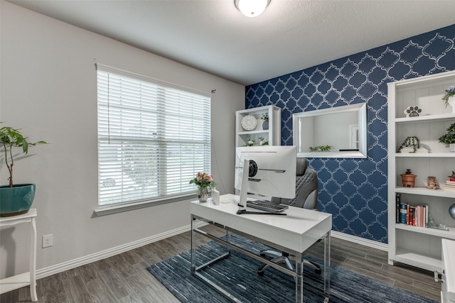 home office featuring dark hardwood / wood-style floors and a textured ceiling