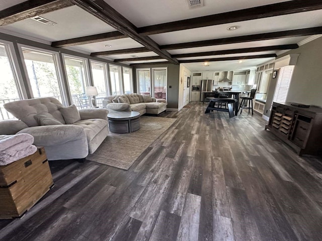 living room with dark hardwood / wood-style floors and beamed ceiling