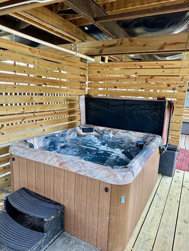 deck featuring a hot tub