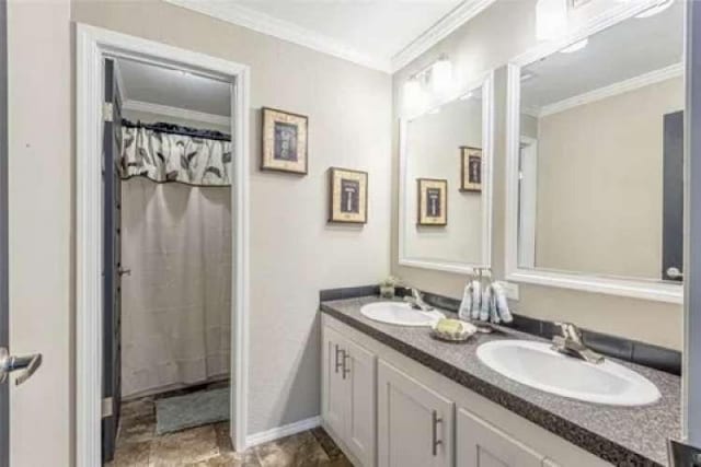 bathroom with vanity and crown molding