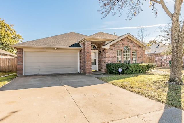 ranch-style house with a garage and a front lawn