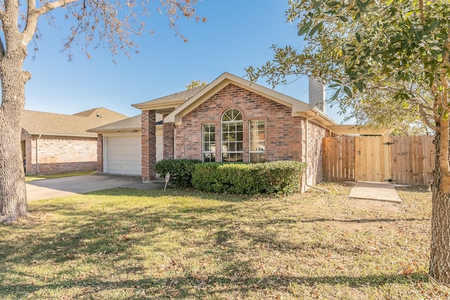 single story home with a garage and a front lawn