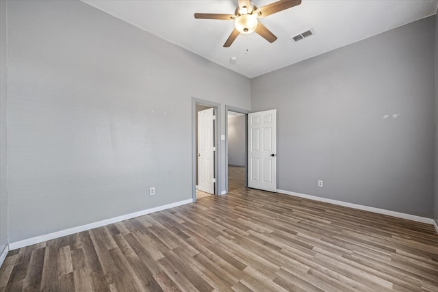 unfurnished room featuring ceiling fan and light wood-type flooring