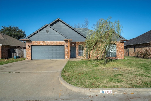 view of front of house featuring a garage and a front lawn