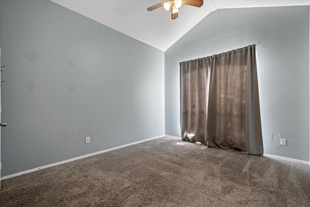 unfurnished room featuring carpet flooring, ceiling fan, and vaulted ceiling