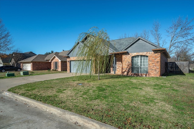 ranch-style house featuring a front yard and a garage