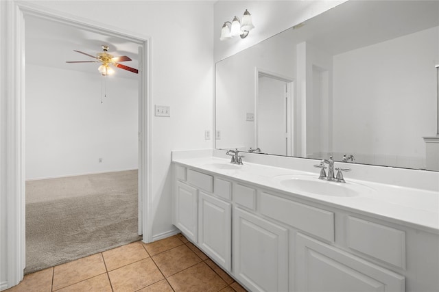 bathroom with tile patterned floors, ceiling fan, and vanity