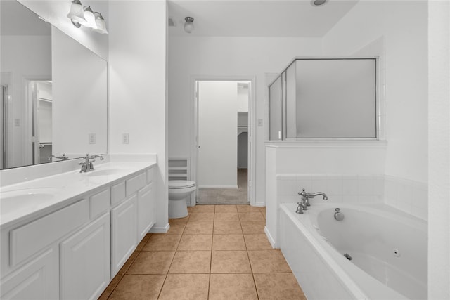 full bathroom with tile patterned flooring, vanity, separate shower and tub, and toilet