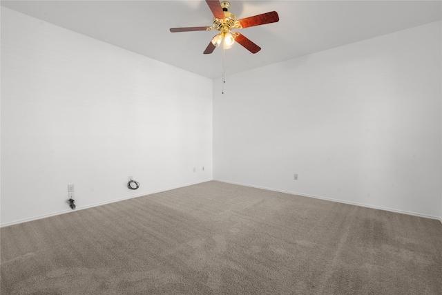 unfurnished room featuring ceiling fan and carpet floors